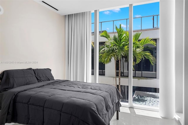 bedroom with a wall of windows