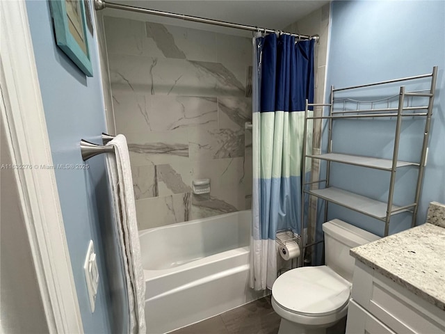 full bathroom with shower / bath combo with shower curtain, toilet, and vanity