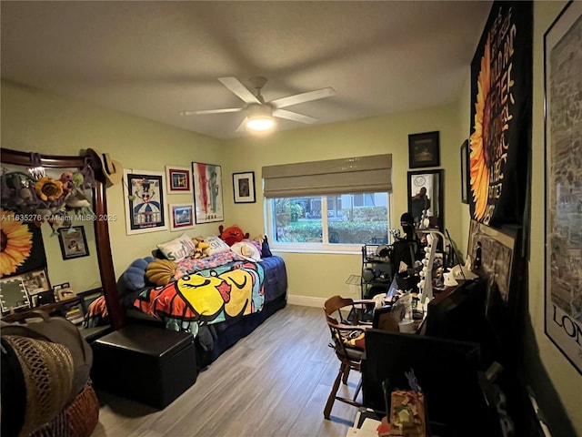 bedroom with light wood-type flooring and ceiling fan