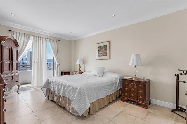 bedroom with light tile patterned floors and ornamental molding