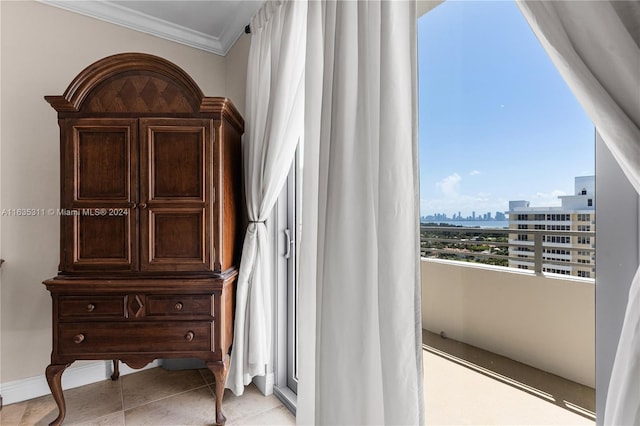 bedroom featuring crown molding and light tile patterned floors