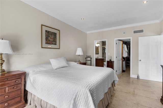 tiled bedroom with a closet, a spacious closet, connected bathroom, and crown molding