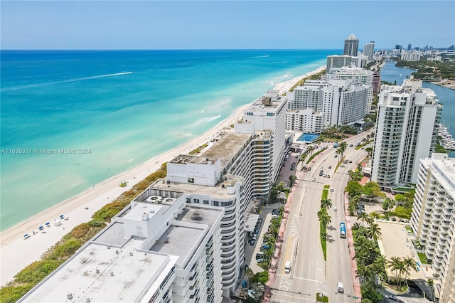 aerial view featuring a water view and a view of the beach