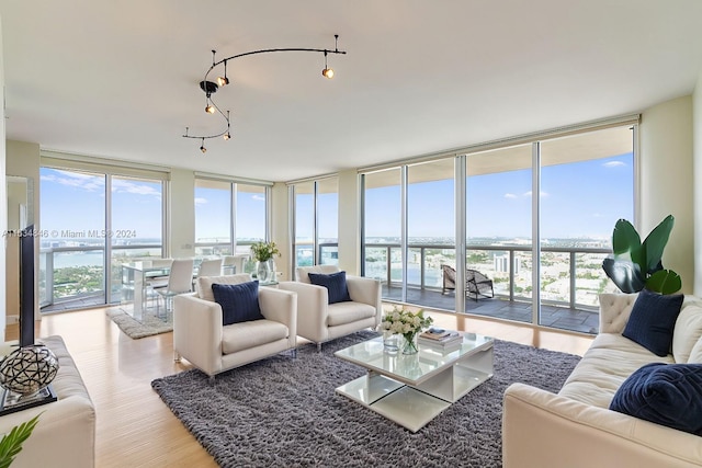 sunroom featuring a water view and a healthy amount of sunlight