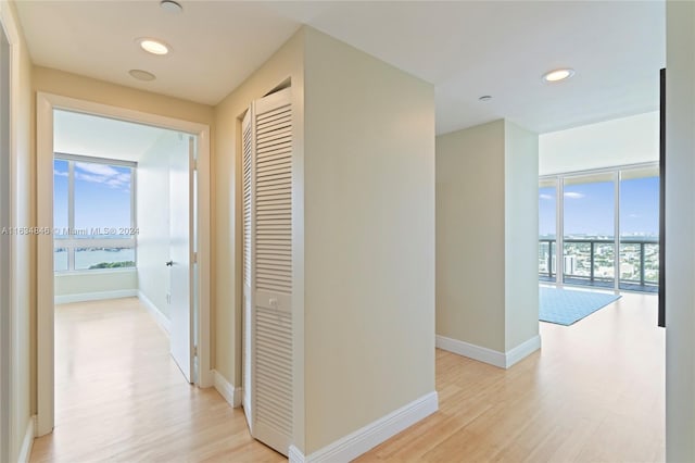 hallway with light wood-type flooring