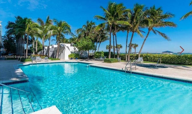 view of swimming pool with a patio area