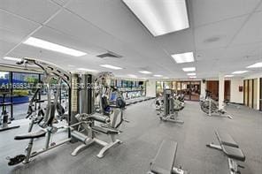 workout area with a paneled ceiling