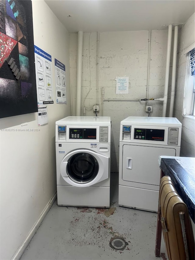 washroom featuring washing machine and dryer