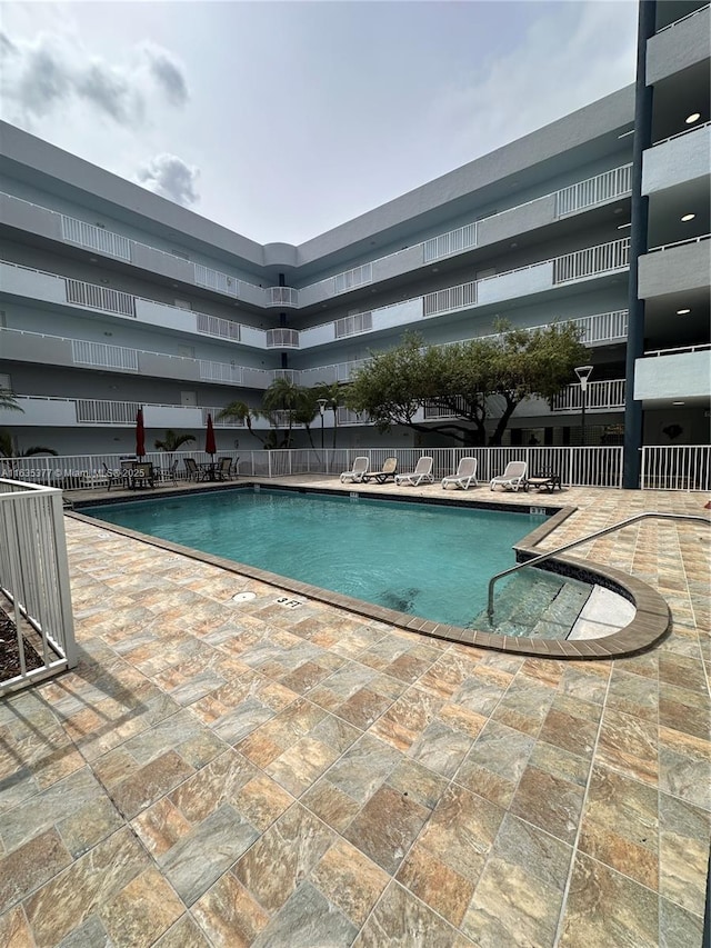 community pool with a patio