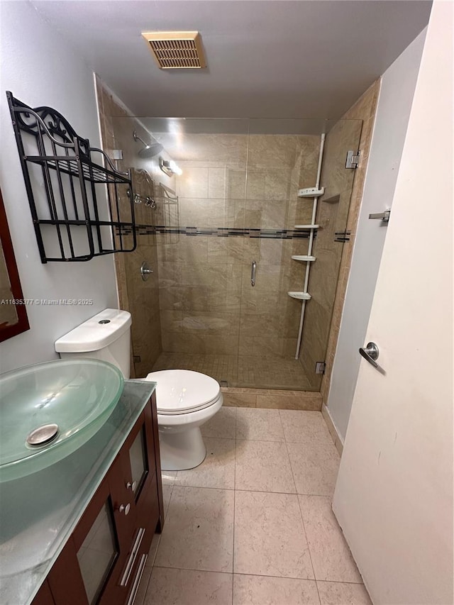 full bathroom with tile patterned flooring, toilet, vanity, visible vents, and a stall shower