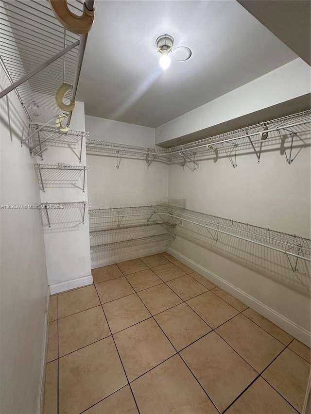 walk in closet featuring light tile patterned floors