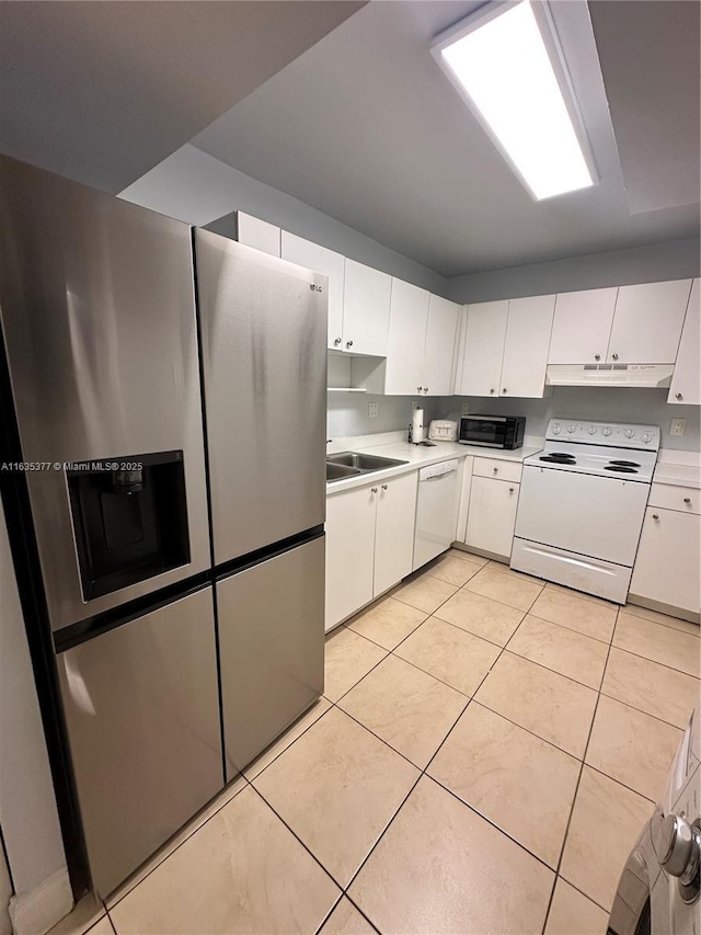 kitchen with light tile patterned floors, light countertops, white cabinets, white appliances, and under cabinet range hood