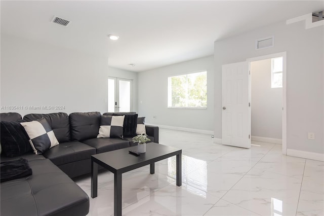 living room with recessed lighting, visible vents, marble finish floor, and baseboards