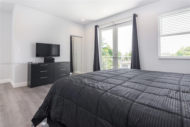 bedroom featuring access to exterior, baseboards, recessed lighting, light wood-style flooring, and french doors