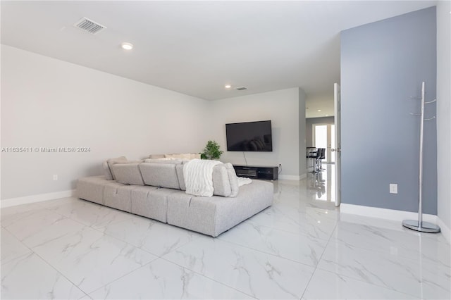 living room with recessed lighting, visible vents, marble finish floor, and baseboards