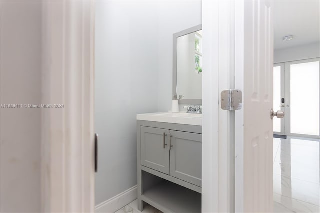 bathroom featuring vanity and baseboards