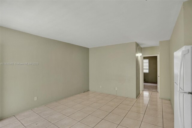 unfurnished room featuring light tile patterned floors