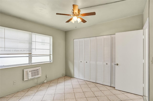 unfurnished bedroom featuring ceiling fan, a closet, and light tile patterned floors