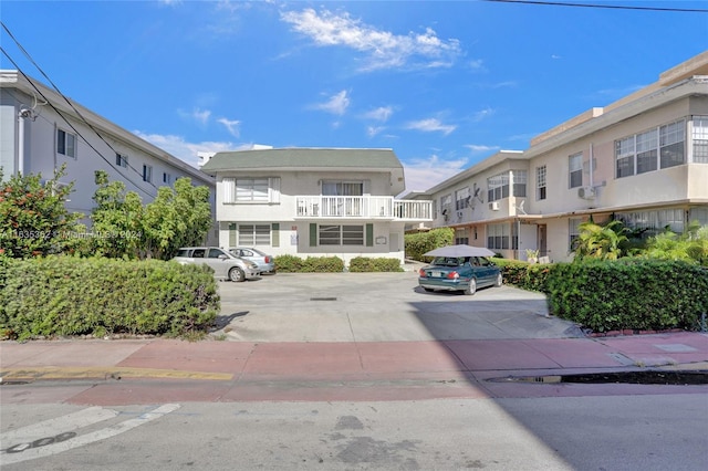 view of property with uncovered parking