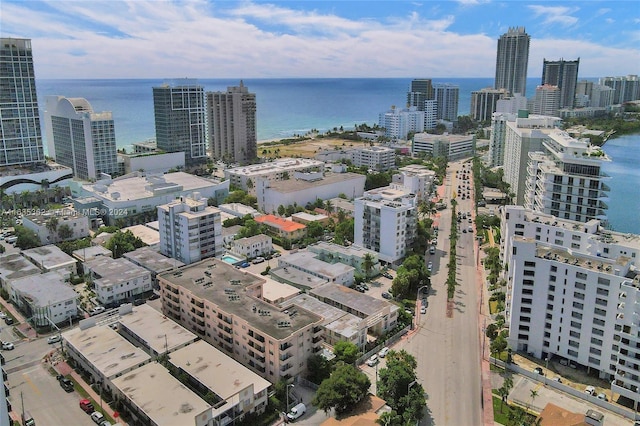 aerial view featuring a view of city and a water view