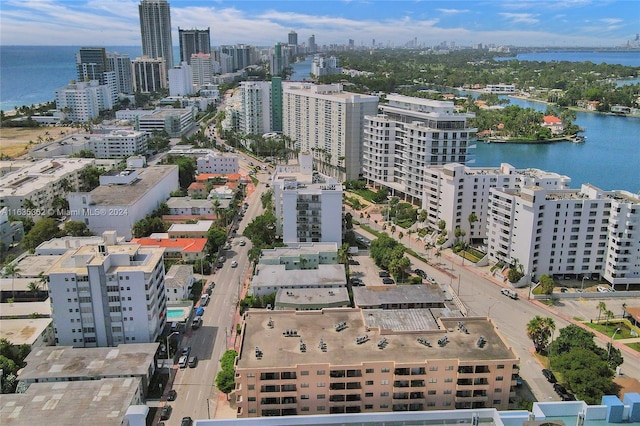 drone / aerial view featuring a water view and a city view