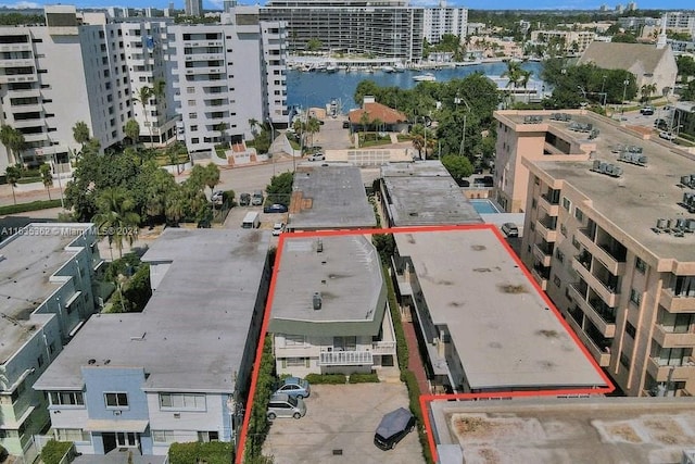 aerial view featuring a view of city and a water view