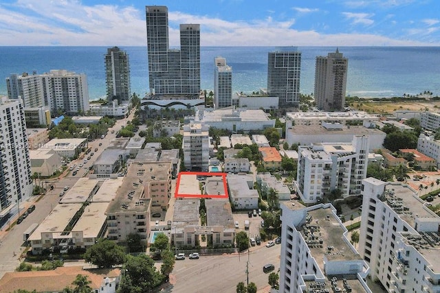 aerial view featuring a view of city and a water view