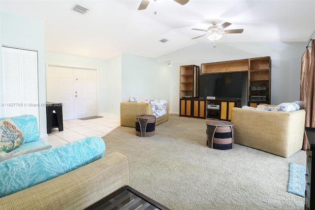 carpeted living room featuring ceiling fan and lofted ceiling