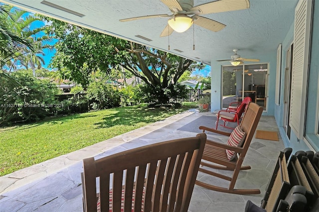 view of patio / terrace featuring ceiling fan