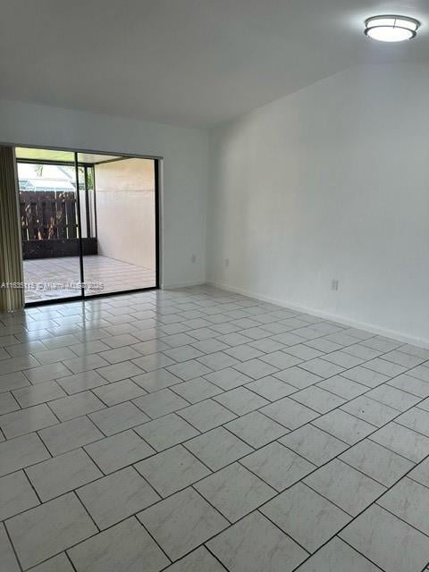 empty room with light tile patterned flooring