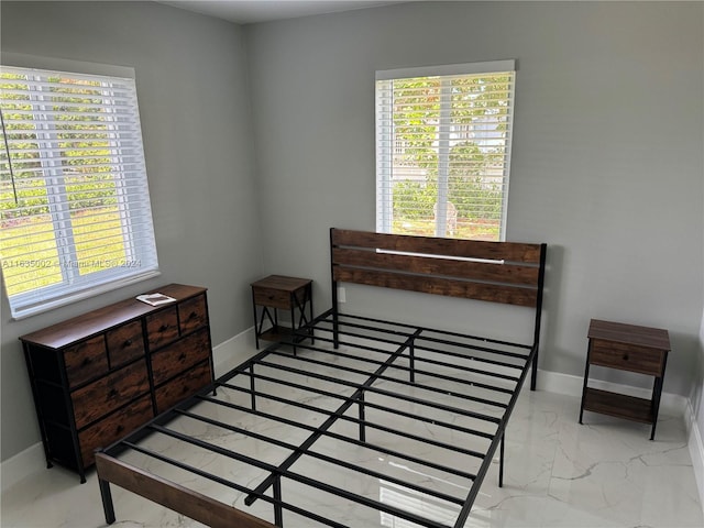 bedroom featuring tile patterned flooring