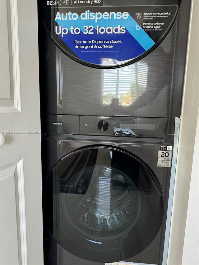 laundry room with stacked washer and clothes dryer