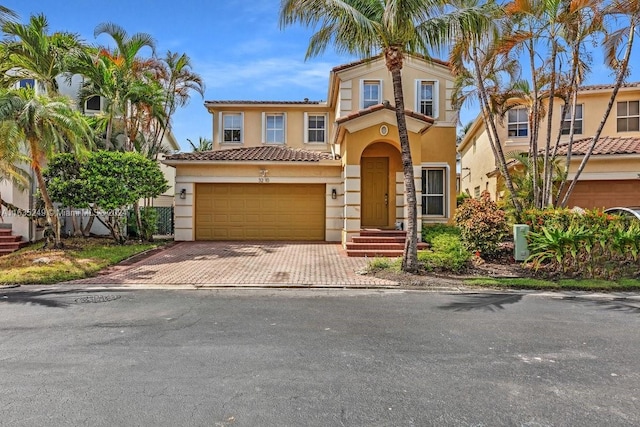 mediterranean / spanish house with a garage