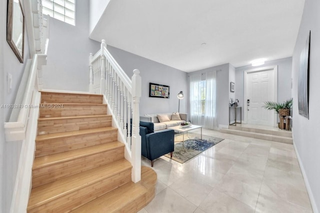 stairway featuring tile patterned flooring