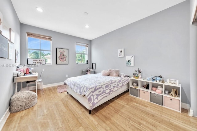 bedroom with hardwood / wood-style floors