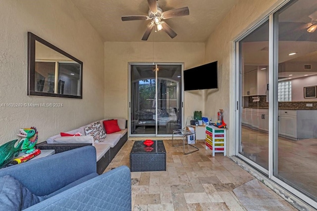 view of patio with an outdoor hangout area and ceiling fan