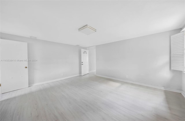 empty room with light wood-type flooring