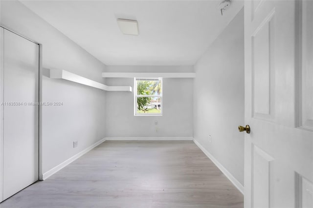 empty room with light wood-type flooring