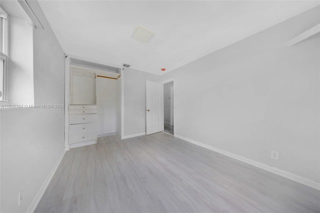 unfurnished bedroom with light hardwood / wood-style floors