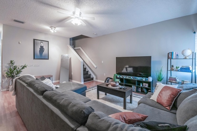 2203 SE 23rd Ter Unit 2203, Homestead, FL 33035 - living area featuring a ceiling fan, wood finished floors, stairs, and visible vents