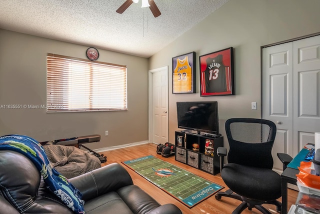 2203 SE 23rd Ter Unit 2203, Homestead, FL 33035 - living room with a textured ceiling, baseboards, ceiling fan, wood finished floors, and lofted ceiling