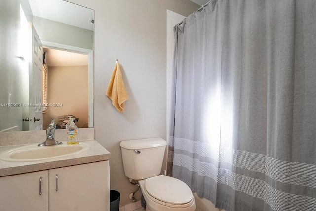 bathroom with toilet and vanity