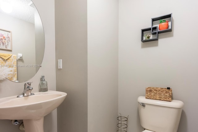 bathroom with sink and toilet