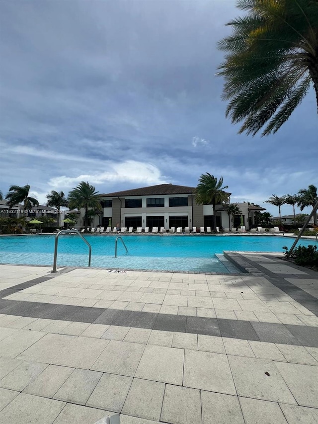 view of swimming pool with a patio area