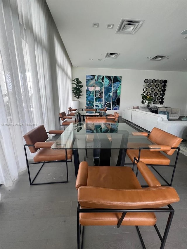 dining space with hardwood / wood-style floors