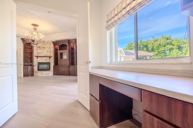 interior space featuring built in features and an inviting chandelier