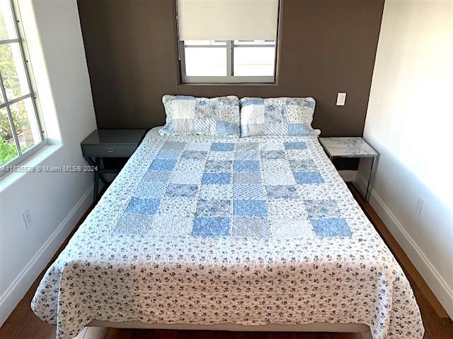 bedroom featuring hardwood / wood-style flooring