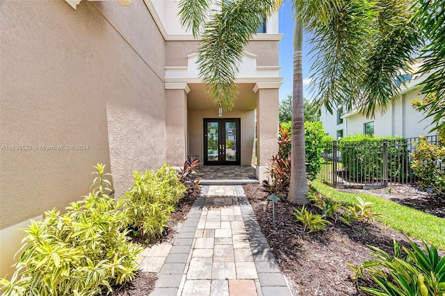 property entrance featuring french doors