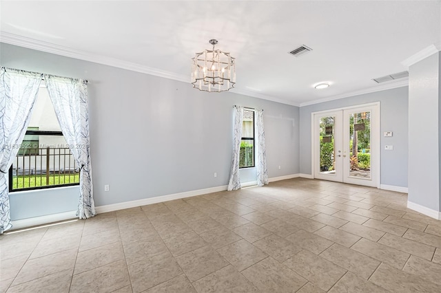 tiled spare room with a notable chandelier, french doors, and ornamental molding