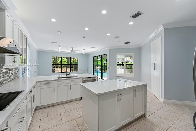 kitchen featuring sink, black electric stovetop, plenty of natural light, and light tile patterned flooring